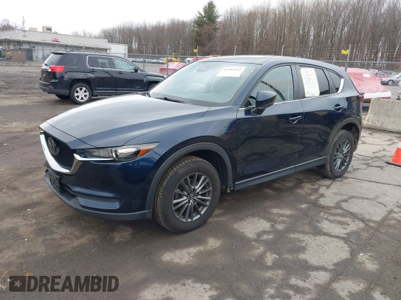 2021 Mazda CX-5 Touring with VIN JM3KFBCM7M1380396, listed as a IAAI auction lot 41707612 with 55,555 mi miles. Bid and sale history available at carsss.com. Image 18.