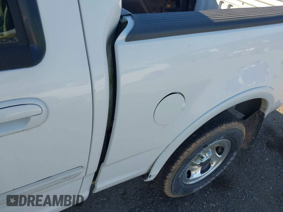 2003 Ford F-150 XLT with VIN 1FTRW08633KD11896, listed as a IAAI auction lot 42137360 with 118,654 mi miles. Bid and sale history available at carsss.com. Image 15.