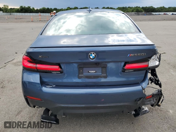 2023 BMW 5 Series M550i xDrive with VIN WBA13BK06PCM31937, listed as a Copart auction lot 66490494 with 24,972 mi miles and Salvage title. Bid and sale history available at DreamBid. Image 6.