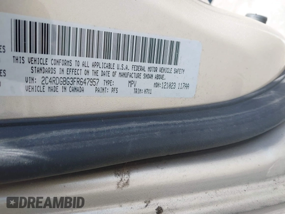 2015 Dodge Grand Caravan American Value with VIN 2C4RDGBG3FR647957, listed as a IAAI auction lot 42147813 with 129,859 mi miles and . Bid and sale history available at DreamBid. Image 9.
