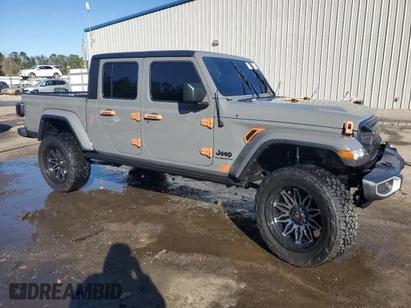 2022 Jeep Gladiator Willys with VIN 1C6HJTAG7NL117102, listed as a Copart auction lot 87679075 with 28,196 mi miles and Salvage title. Bid and sale history available at DreamBid. Image 4.