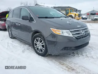 2013 Honda Odyssey EX-L with VIN 5FNRL5H65DB055040, listed as a IAAI auction lot 41615182 with 246,225 mi miles and . Bid and sale history available at carsss.com. Image 1.
