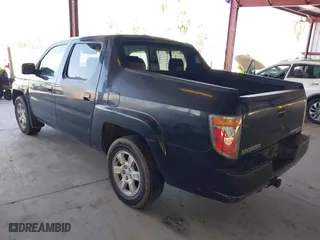2006 Honda Ridgeline RTL with VIN 2HJYK16556H566886, listed as a IAAI auction lot 42077035 with 124,310 mi miles. Bid and sale history available at carsss.com. Image 3.