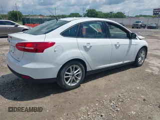 2016 Ford Focus SE z VIN 1FADP3F29GL346196, wystawiony jako IAAI lot #42171014 z przebiegiem 80 913 mil mil oraz . Historia ofert i sprzedaży dostępna na DreamBid. Obrazek 4.