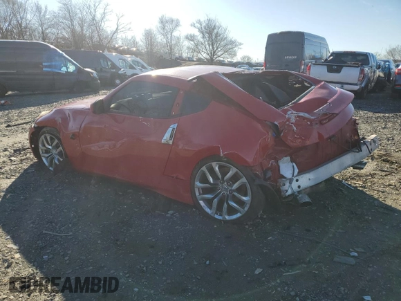 2014 Nissan 370Z Nismo with VIN JN1AZ4EH7EM630228, listed as a Copart auction lot 87024444 with 88,456 mi miles and Salvage title. Bid and sale history available at DreamBid. Image 2.