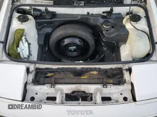 1986 Toyota MR2 z VIN JT2AW15C7G0083196, wystawiony jako Copart lot #74149374 z przebiegiem 30 771 mil mil oraz Nie do naprawy. Historia ofert i sprzedaży dostępna na DreamBid. Obrazek 11.
