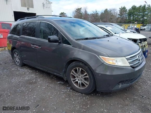 2012 Honda Odyssey EX with VIN 5FNRL5H42CB086159, listed as a IAAI auction lot 42096834 with 208,701 mi miles. Bid and sale history available at carsss.com. Image 1.