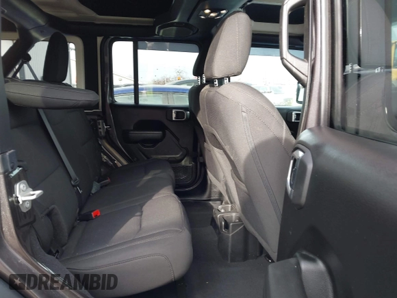 2023 Jeep Wrangler Sport S with VIN 1C4HJXDN6PW653924, listed as a IAAI auction lot 41413689 with 15,278 mi miles and . Bid and sale history available at DreamBid. Image 8.