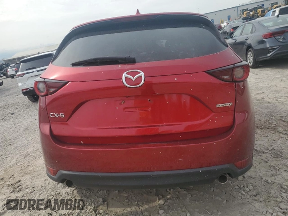 2021 Mazda CX-5 Touring with VIN JM3KFACM7M0334633, listed as a Copart auction lot 51618875 with 70,558 mi miles and Salvage Title. Bid and sale history available at DreamBid. Image 6.