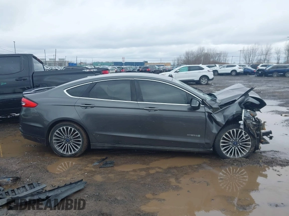 2017 Ford Fusion Hybrid Titanium z VIN 3FA6P0RU6HR279726, wystawiony jako IAAI lot #41736889 z przebiegiem 123 698 mil mil oraz . Historia ofert i sprzedaży dostępna na DreamBid. Obrazek 13.