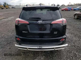 2018 Toyota RAV4 XLE with VIN 2T3RFREV6JW735352, listed as a Copart auction lot 46938025 with 73,229 mi miles and Salvage title. Bid and sale history available at DreamBid. Image 6.
