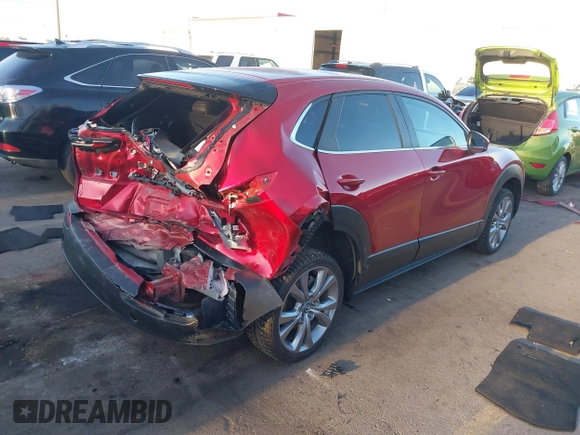 2022 Mazda CX-30 S Carbon Edition с VIN 3MVDMBCL4NM431242, выставлен на аукционе IAAI как лот 41851636 с пробегом 40 982 миль миль и . История ставок и продаж доступна на DreamBid. Изображение 4.