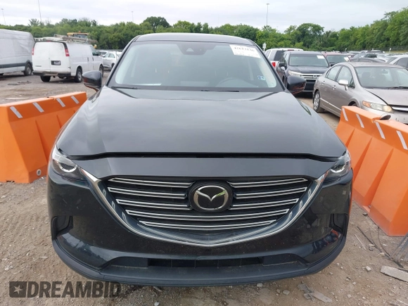 2021 Mazda CX-9 Sport with VIN JM3TCABY6M0522352, listed as a IAAI auction lot 42613136 with 106,167 mi miles and . Bid and sale history available at DreamBid. Image 12.
