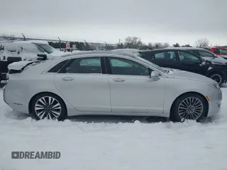 2014 Lincoln MKZ z VIN 3LN6L2JK9ER813109, wystawiony jako IAAI lot #41444866 z przebiegiem 128 613 mil mil oraz . Historia ofert i sprzedaży dostępna na DreamBid. Obrazek 14.