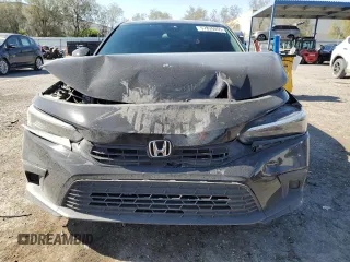2023 Honda Civic Sport with VIN 2HGFE2F52PH526843, listed as a Copart auction lot 57826055 with 28,758 mi miles and Salvage title. Bid and sale history available at DreamBid. Image 5.