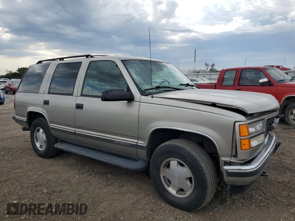 1999 GMC Yukon with VIN 1GKEK13R9XJ787877, listed as a Copart auction lot 72185044 with 191,710 mi miles and Salvage Title. Bid and sale history available at carsss.com. Image 4.