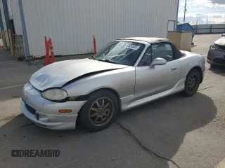 2003 Mazda MX-5 Miata Cloth z VIN JM1NB353X30311086, wystawiony jako Copart lot #57685445 z przebiegiem 141 634 mil mil oraz Szkoda całkowita • Salvage title. Historia ofert i sprzedaży dostępna na DreamBid. Obrazek 1.