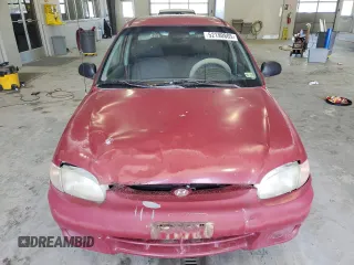 1999 Hyundai Accent z VIN KMHVF24N5XU575750, wystawiony jako Copart lot #52190805 z przebiegiem 205 655 mil mil oraz Tytuł czysty. Historia ofert i sprzedaży dostępna na DreamBid. Obrazek 5.