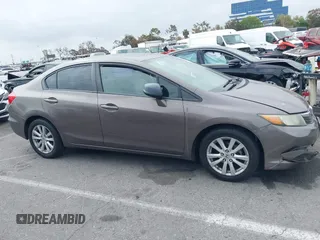 2012 Honda Civic EX with VIN 2HGFB2F89CH517330, listed as a IAAI auction lot 42116208 with 196,861 mi miles and . Bid and sale history available at DreamBid. Image 13.