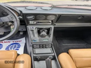 1988 Alfa Romeo Spider z VIN ZARBC5767J1056025, wystawiony jako Copart lot #58116455 z przebiegiem 78 443 mil mil oraz Tytuł czysty. Historia ofert i sprzedaży dostępna na DreamBid. Obrazek 9.