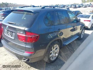 2011 BMW X5 35i with VIN 5UXZV4C51BL740731, listed as a IAAI auction lot 41771257 with 148,638 mi miles. Bid and sale history available at carsss.com. Image 4.