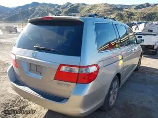 2005 Honda Odyssey EX-L with VIN 5FNRL38795B039731, listed as a IAAI auction lot 41844588 with 150,738 mi miles. Bid and sale history available at carsss.com. Image 4.