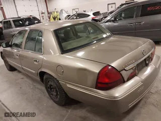 2004 Mercury Grand Marquis GS with VIN 2MEFM74W04X618043, listed as a IAAI auction lot 41985566 with 192,836 mi miles. Bid and sale history available at carsss.com. Image 3.