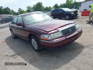 2005 Mercury Grand Marquis GS z VIN 2MEFM74W05X641274, wystawiony jako IAAI lot #42298098 z przebiegiem 159 424 mil mil oraz . Historia ofert i sprzedaży dostępna na DreamBid. Obrazek 1.