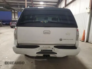 2000 Cadillac Escalade z VIN 1GYEK63R0YR185780, wystawiony jako Copart lot #80620994 z przebiegiem 16 717 mil mil oraz Szkody całkowita. Historia ofert i sprzedaży dostępna na DreamBid. Obrazek 6.