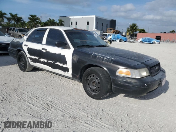2005 Ford Police Interceptor with VIN 2FAFP71W35X128684, listed as a Copart auction lot 54002165 with 144,766 mi miles and Clean title. Bid and sale history available at DreamBid. Image 4.