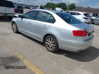 2012 Volkswagen Jetta Sedan SE w/Convenience with VIN 3VWDX7AJ1CM401939, listed as a IAAI auction lot 41941070 with 123,611 mi miles. Bid and sale history available at carsss.com. Image 3.