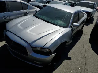 2014 Dodge Charger RT Plus with VIN 2C3CDXCT4EH307940, listed as a Copart auction lot 64035484 with 129,665 mi miles and Salvage Title. Bid and sale history available at carsss.com. Image 1.