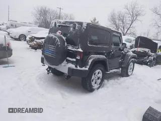 2014 Jeep Wrangler Sahara with VIN 1C4AJWBG3EL190302, listed as a IAAI auction lot 41299284 with 112,476 mi miles and . Bid and sale history available at DreamBid. Image 4.