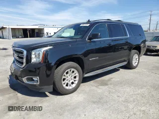 2018 GMC Yukon XL SLT with VIN 1GKS1GKCXJR166856, listed as a Copart auction lot 48827075 with 104,772 mi miles and Salvage Title. Bid and sale history available at carsss.com. Image 1.