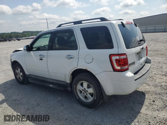 2012 Ford Escape XLT with VIN 1FMCU9D73CKC29497, listed as a Copart auction lot 63211965 with 142,134 mi miles and Salvage title. Bid and sale history available at DreamBid. Image 2.