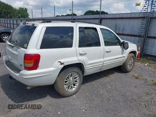 2002 Jeep Grand Cherokee Limited z VIN 1J4GX58N62C195783, wystawiony jako IAAI lot #42745397 z przebiegiem 242 502 mil mil oraz . Historia ofert i sprzedaży dostępna na DreamBid. Obrazek 4.