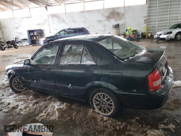 1999 Mazda Protege DX z VIN JM1BJ2220X0108600, wystawiony jako Copart lot #77004894 z przebiegiem 220 836 mil mil oraz Szkoda całkowita • Salvage title. Historia ofert i sprzedaży dostępna na DreamBid. Obrazek 2.