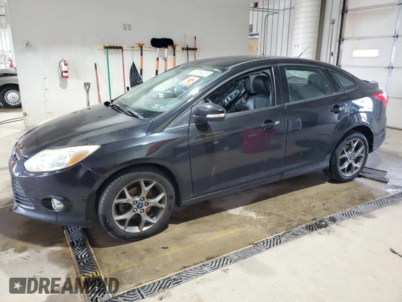 2013 Ford Focus SE with VIN 1FADP3F21DL348827, listed as a Copart auction lot 63589405 with 144,156 mi miles and Salvage title. Bid and sale history available at DreamBid. Image 1.