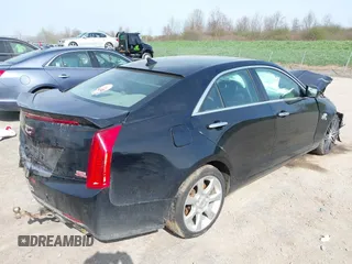 2014 Cadillac ATS Standard AWD with VIN 1G6AG5RX6E0105293, listed as a IAAI auction lot 42142760 with 138,313 mi miles and . Bid and sale history available at DreamBid. Image 4.