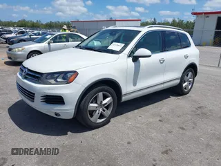 2012 Volkswagen Touareg Sport with VIN WVGEF9BP1CD008717, listed as a IAAI auction lot 42120641 with 211,580 mi miles and . Bid and sale history available at DreamBid. Image 2.