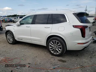 2023 Cadillac XT6 FWD Premium Luxury with VIN 1GYKPCRS5PZ120161, listed as a Copart auction lot 54614235 with 39,700 mi miles and Salvage title. Bid and sale history available at DreamBid. Image 2.