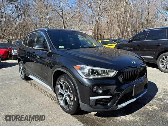 2017 BMW X1 xDrive28i with VIN WBXHT3C32H5F67896, listed as a IAAI auction lot 41823288 with 80,130 mi miles. Bid and sale history available at carsss.com. Image 1.
