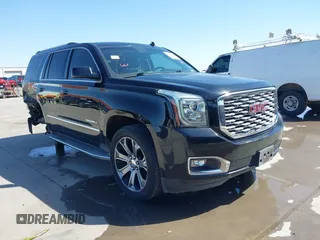 2015 GMC Yukon Denali with VIN 1GKS1CKJ8FR300357, listed as a IAAI auction lot 41708454 with 183,563 mi miles. Bid and sale history available at carsss.com. Image 1.
