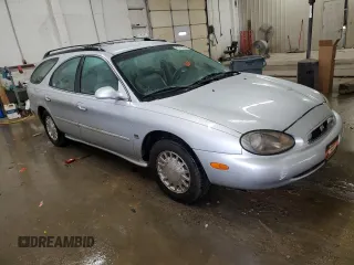 1999 Mercury Sable z VIN 1MEFM58S6XA647250, wystawiony jako Copart lot #83479674 z przebiegiem 166 550 mil mil oraz Szkody całkowita. Historia ofert i sprzedaży dostępna na DreamBid. Obrazek 4.