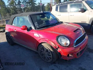 2013 MINI Convertible S with VIN WMWZP3C55DT705938, listed as a IAAI auction lot 41372294 with 118,481 mi miles and . Bid and sale history available at DreamBid. Image 1.