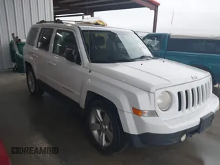 2014 Jeep Patriot Latitude with VIN 1C4NJPFA3ED618523, listed as a IAAI auction lot 41108657 with 124,035 mi miles and . Bid and sale history available at carsss.com. Image 1.