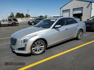 2018 Cadillac CTS Luxury AWD with VIN 1G6AX5SSXJ0106956, listed as a Copart auction lot 58604255 with 57,617 mi miles and Salvage title. Bid and sale history available at DreamBid. Image 1.
