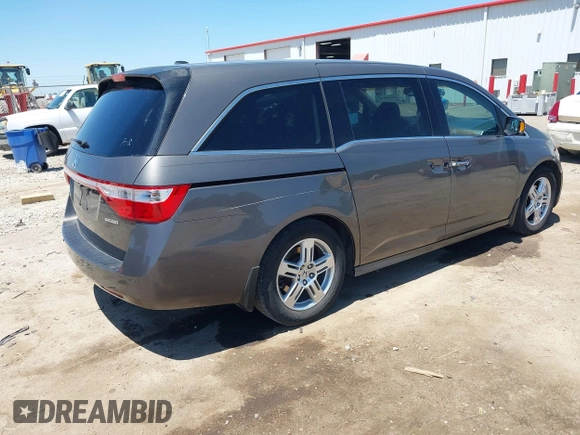 2012 Honda Odyssey Touring with VIN 5FNRL5H93CB109394, listed as a IAAI auction lot 42280018 with 190,412 mi miles and . Bid and sale history available at DreamBid. Image 4.