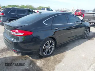 2017 Ford Fusion Titanium with VIN 3FA6P0K91HR257462, listed as a IAAI auction lot 42079361 with 124,914 mi miles and . Bid and sale history available at DreamBid. Image 4.