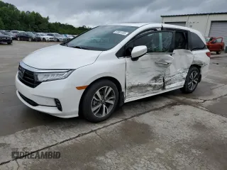 2023 Honda Odyssey Touring z VIN 5FNRL6H89PB016527, wystawiony jako Copart lot #59901335 z przebiegiem 20 033 mil mil oraz Szkoda całkowita • Salvage title. Historia ofert i sprzedaży dostępna na DreamBid. Obrazek 1.